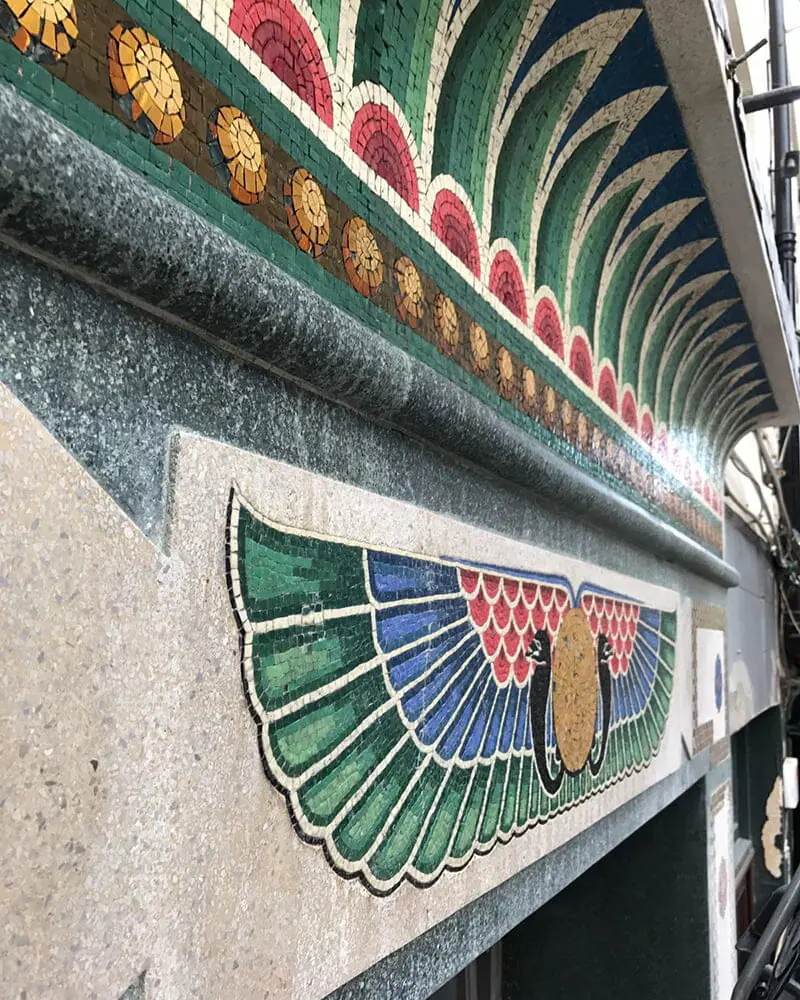 Re-bedding-mosaic-tiles-on-facade-of-Bewleys