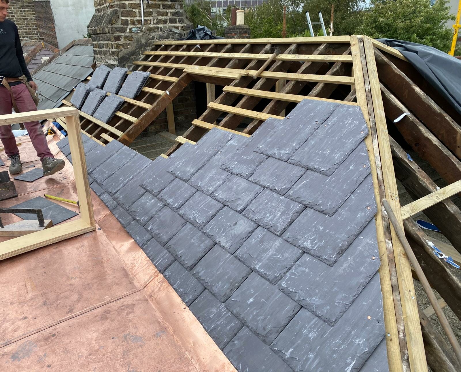 Fixing beams and replacing slate tiles