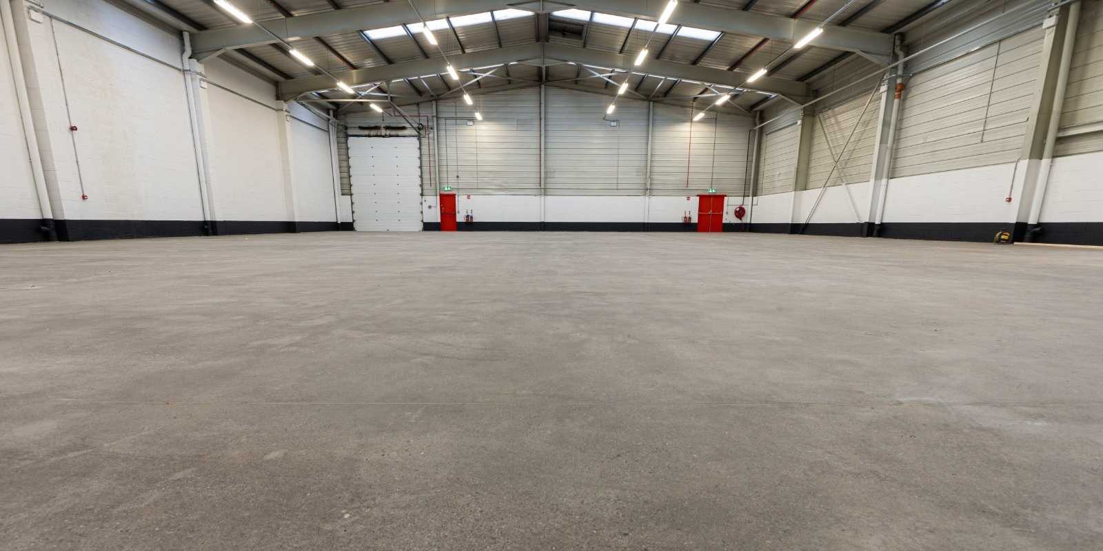 Warehouse concrete floor polished by PMAC removing all contamination and making smooth and clean