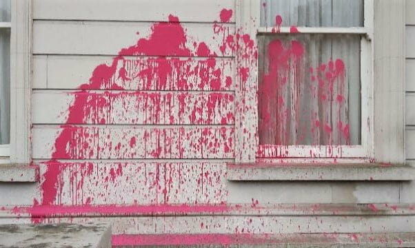 Pink gloss paint scattered on Iveagh House