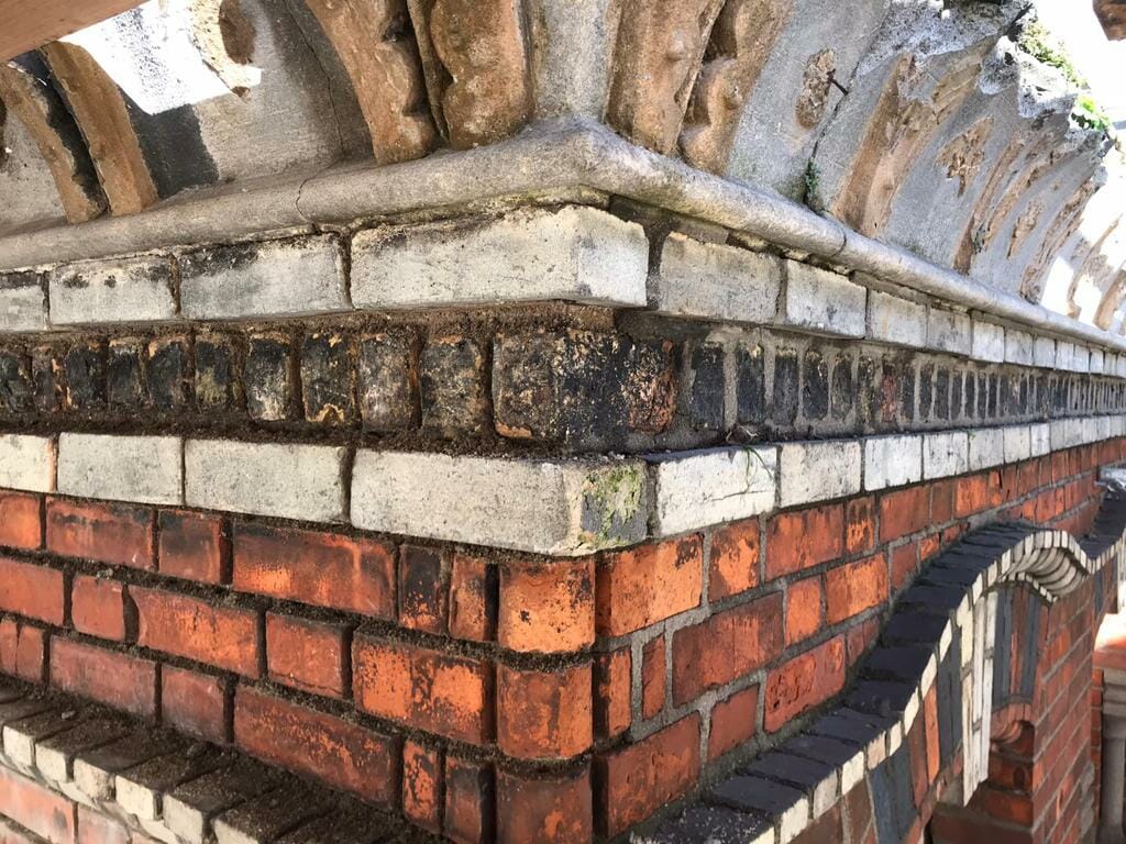 Trinity Street b4 1 Side view of brickwork that is showing signs of damage