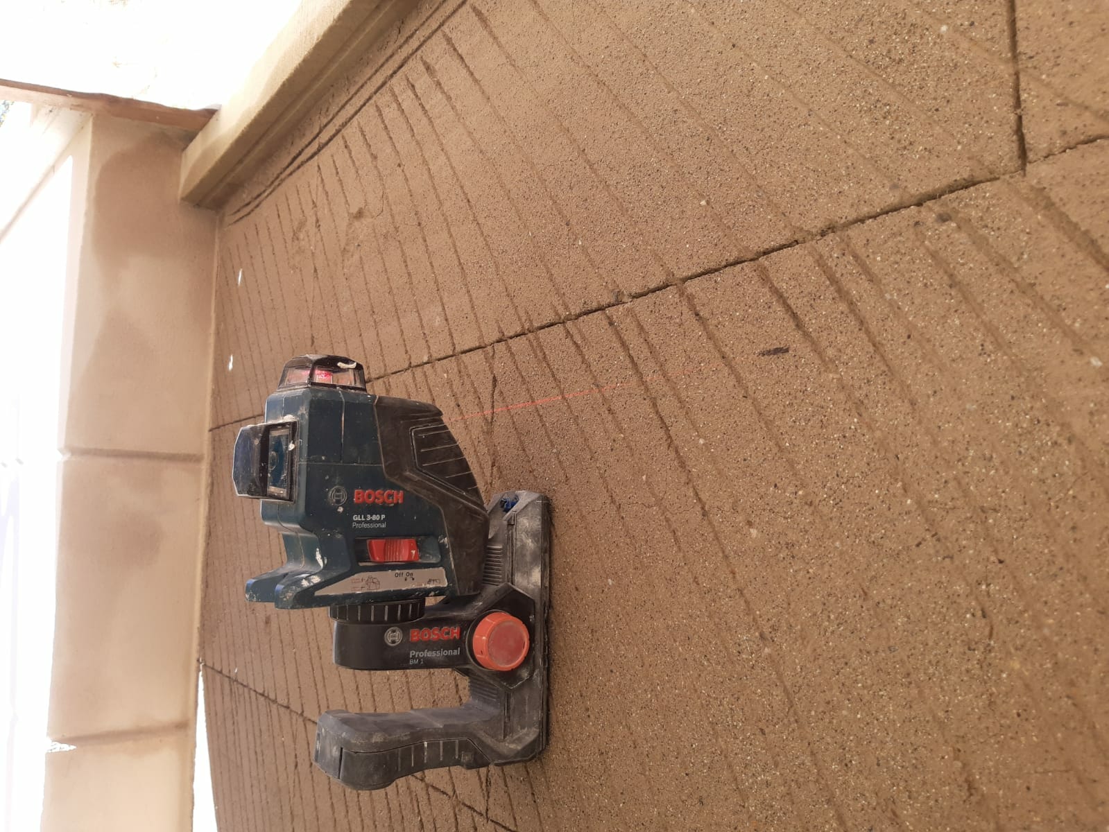 Applying Line Stucco to walls. jpg