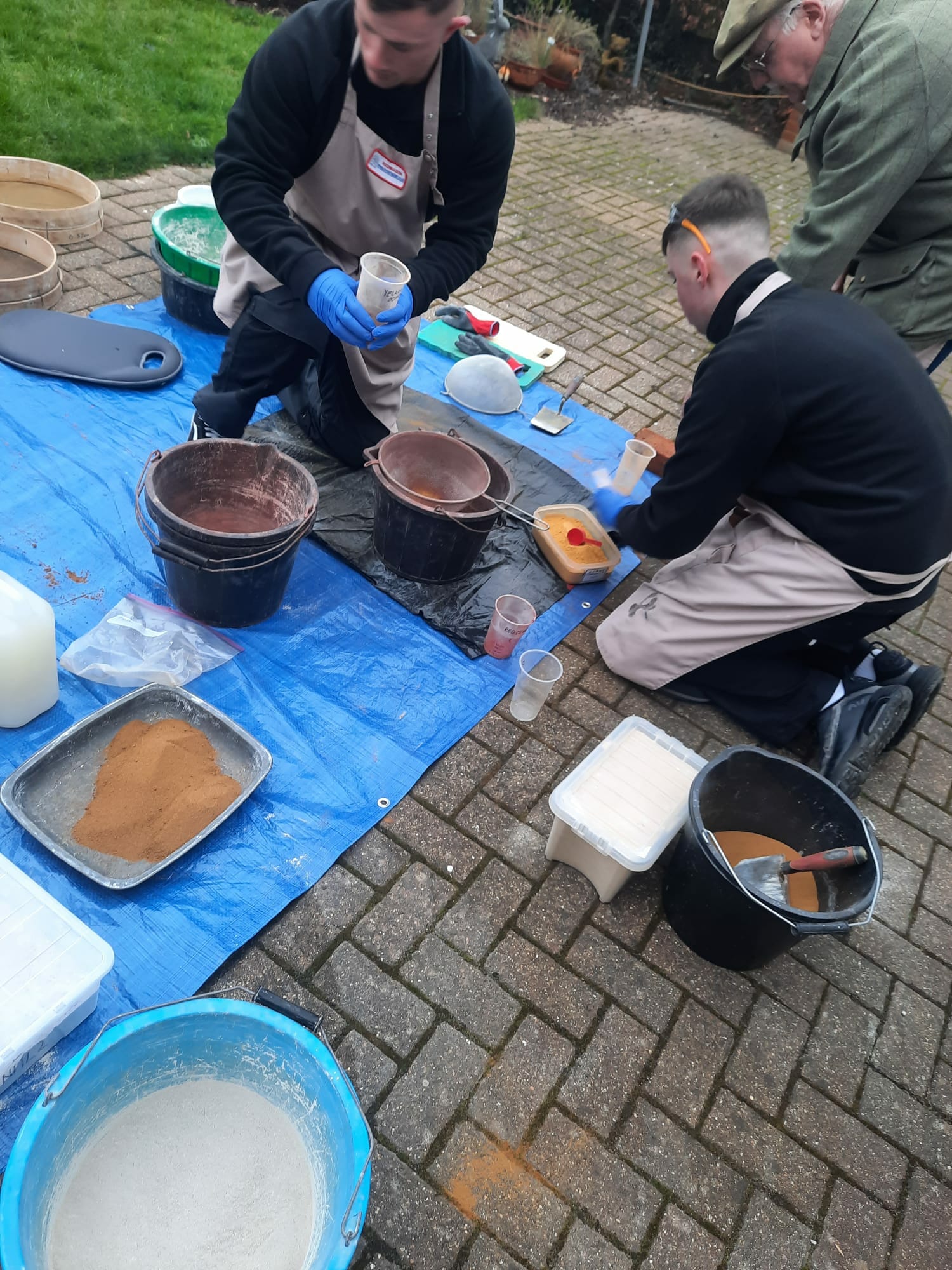 PMAC Brick Restoration Crew in training mortar mixes Mixing historic lime based mortars