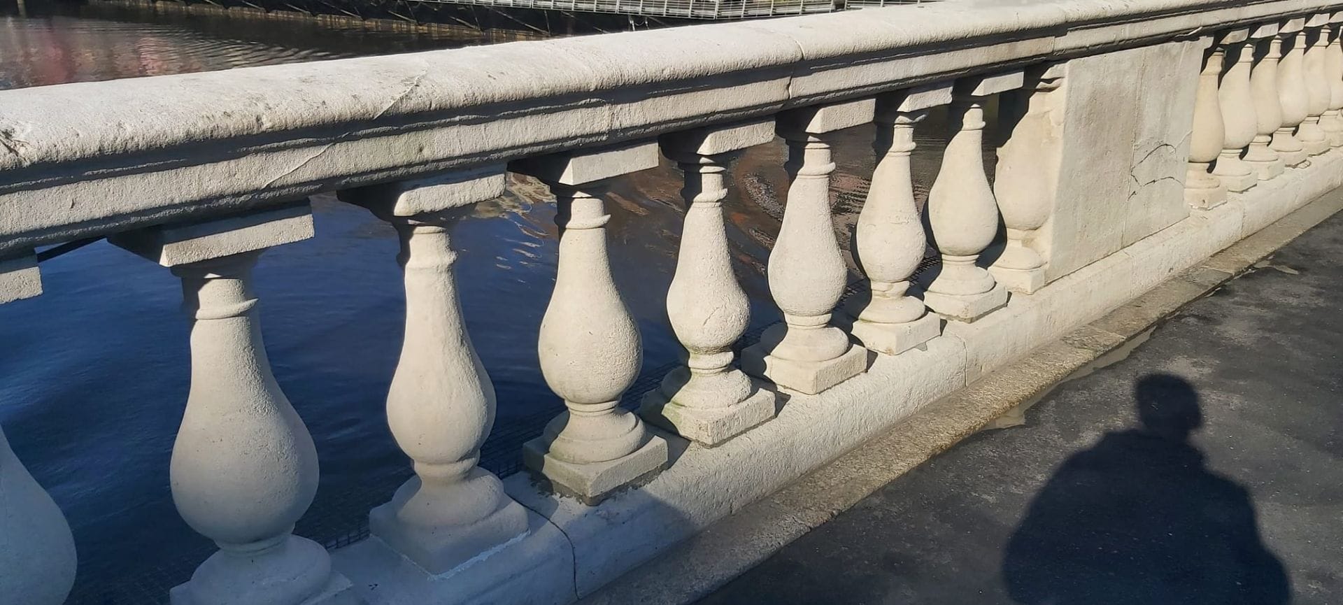 Granite stone pillars on O'Connell Bridge post heritage cleaning by PMAC